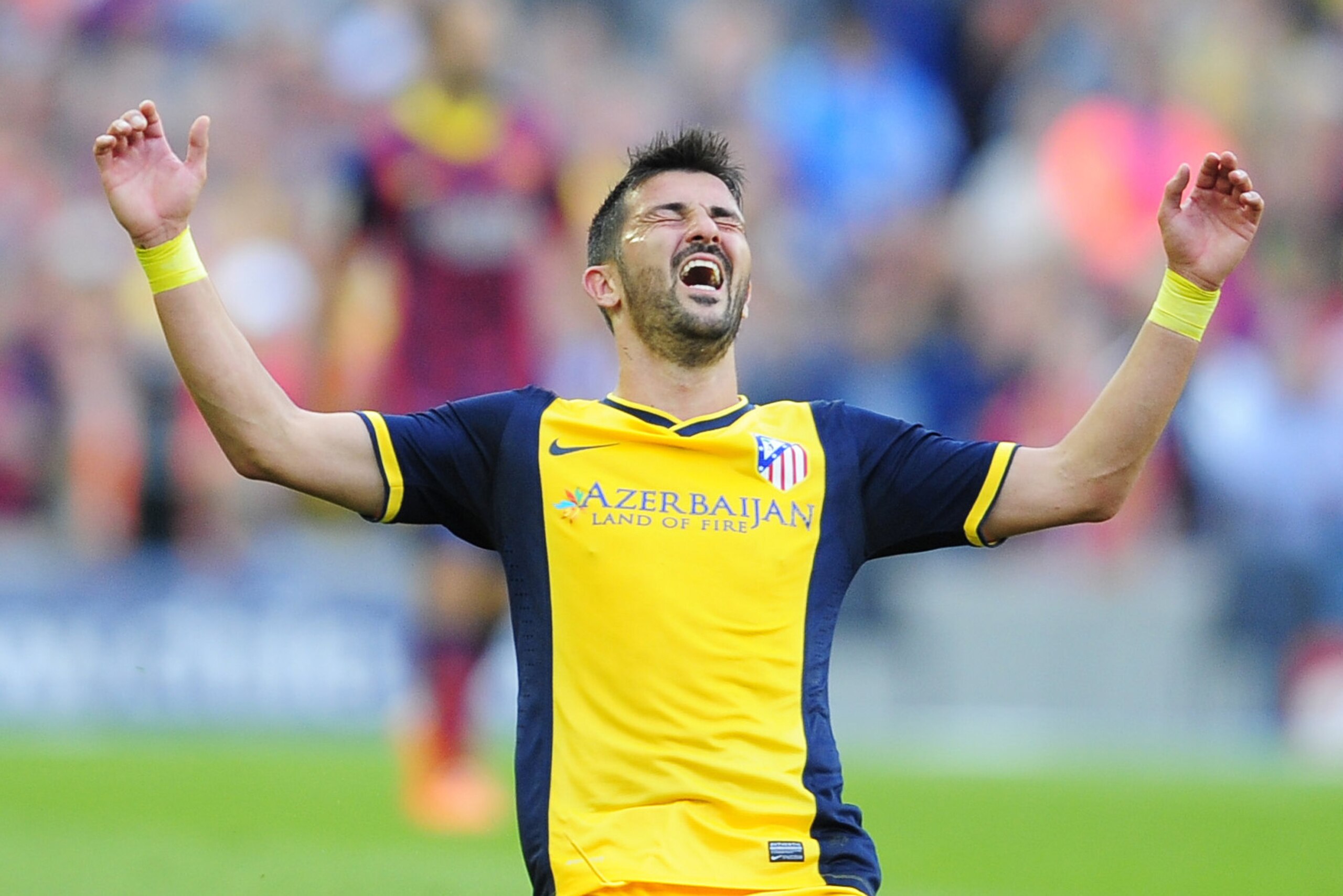 FILE - In this May 17, 2014 file photo, Atletico's David Villa celebrates at the end of a Spanish La Liga soccer match between FC Barcelona and Atletico Madrid at the Camp Nou stadium in Barcelona, Spain. Villa has signed a three-year contract with New York City FC, becoming the first player on the expansion Major League Soccer team that starts play next season. (AP Photo/Manu Fernandez, File)