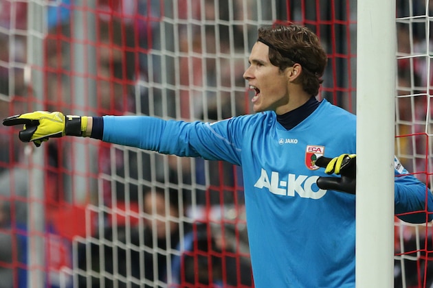 Augsburg goalkeeper Marwin Hitz of Switzerland gestures during the German first division Bundesliga soccer match between FC Bayern Munich and FC Augsburg, in Munich, southern Germany, Saturday, Nov. 9, 2013. (AP Photo/Matthias Schrader)