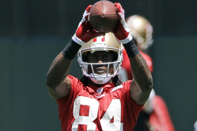 San Francisco 49ers wide receiver Brandon Lloyd makes a catch during an NFL football organized team activity, Tuesday, June 3, 2014, in Santa Clara, Calif. (AP Photo/Marcio Jose Sanchez)