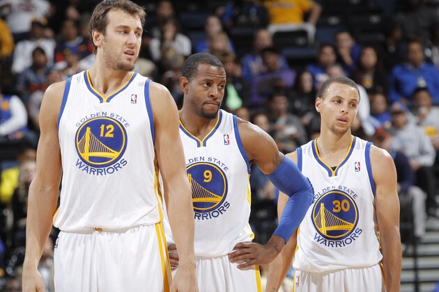 OAKLAND, CA - OCTOBER 24: Andrew Bogut #12, Andre Iguodala #9 and Stephen Curry #30 of the Golden State Warriors in a game against the Portland Trail Blazers on October 24, 2013 at Oracle Arena in Oakland, California. NOTE TO USER: User expressly acknowledges and agrees that, by downloading and or using this photograph, user is consenting to the terms and conditions of Getty Images License Agreement. Mandatory Copyright Notice: Copyright 2013 NBAE (Photo by Rocky Widner/NBAE via Getty Images)