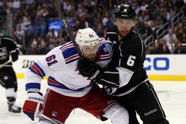 LOS ANGELES, CA - JUNE 04:  Rick Nash #61 of the New York Rangers collides with Jake Muzzin #6 of the Los Angeles Kings during Game One of the 2014 NHL Stanley Cup Final at the Staples Center on June 4, 2014 in Los Angeles, California.  (Photo by Bruce Bennett/Getty Images)