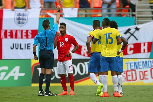 MIAMI GARDENS, FL - JUNE 04:  The referee shows Raheem Sterling of England a red card during the International friendly match between England and Ecuador at Sun Life Stadium on June 4, 2014 in Miami Gardens, Florida.  (Photo by Richard Heathcote/Getty Images)