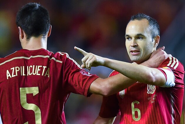 SEVILLE, SPAIN - MAY 30:  Andres Iniesta (2ndL) of Spain celebrates wit his teammates after scoring his team's second goal during an international friendly match between Spain and Bolivia at Estadio Ramon Sanchez Pizjuan on May 30, 2014 in Seville, Spain.  (Photo by David Ramos/Getty Images)