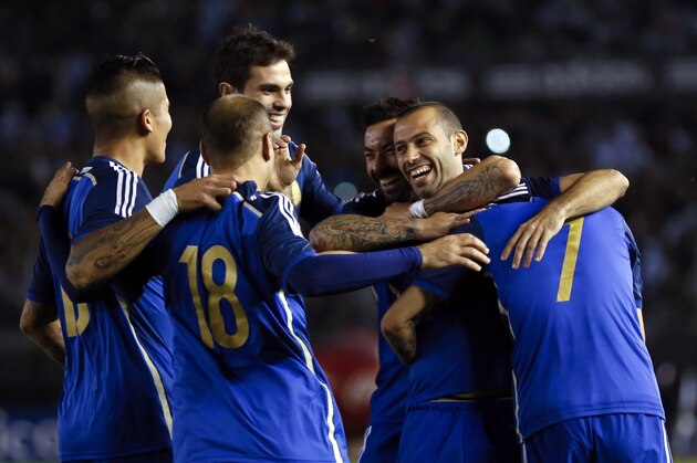 Argentina's Javier Mascherano, second right, celebrates with teammates after scoring against Trinidad and Tobago during their international friendly soccer match in Buenos Aires, Argentina, Wednesday, June 4, 2014. (AP Photo/Natacha Pisarenko)