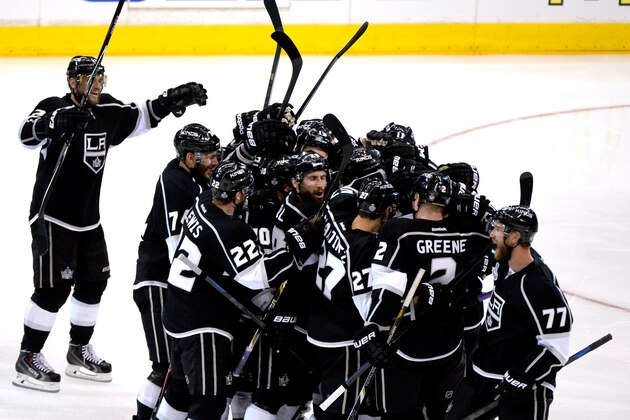 LOS ANGELES, CA - JUNE 04:  Justin Williams #14 of the Los Angeles Kings and teammates celebrate Williams overtime game-winner against the New York Rangers during Game One of the 2014 NHL Stanley Cup Final at the Staples Center on June 4, 2014 in Los Angeles, California.  (Photo by Harry How/Getty Images)
