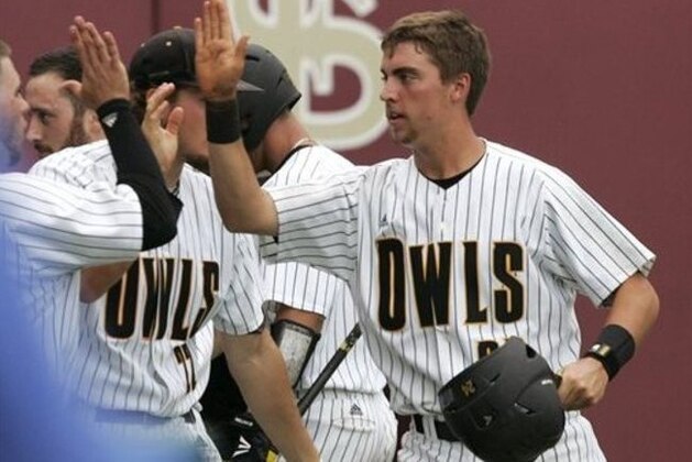 Kennesaw State's Jeremy Howell, right, is greeted by his teammates after scoring against Alabama in the seventh inning of an NCAA college baseball regional game on Monday, June 2, 2014, in Tallahassee, Fla. Kennesaw State won the rubber match over Alabama 4-2 to move on to the super regional expected to be in Louisville. (AP Photo/Steve Cannon)