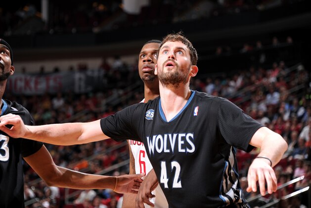HOUSTON, TX - MARCH 20:  Kevin Love #42 of the Minnesota Timberwolves battles for position against Terrence Jones #6 of the Houston Rockets on March 20, 2014 at the Toyota Center in Houston, Texas. NOTE TO USER: User expressly acknowledges and agrees that, by downloading and or using this photograph, User is consenting to the terms and conditions of the Getty Images License Agreement. Mandatory Copyright Notice: Copyright 2014 NBAE (Photo by Bill Baptist/NBAE via Getty Images)