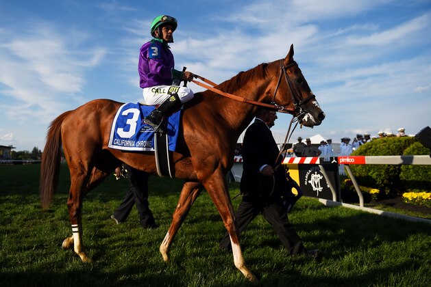 BALTIMORE, MD - MAY 17:  Victor Espinoza rides atop California Chrome #3 during the post parade for the 139th running of the Preakness Stakes at Pimlico Race Course on May 17, 2014 in Baltimore, Maryland.  (Photo by Patrick Smith/Getty Images)