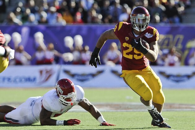Southern California running back Ty Isaac (29) rushes the ball against Fresno State during the second quarter of the Royal Purple Bowl NCAA college football game, Saturday, Dec. 21, 2013, in Las Vegas. (AP Photo/David Cleveland)