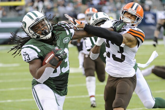 New York Jets running back Chris Ivory (33) stiff-arms Cleveland Browns' Joe Haden (23) during the second half of an NFL football game Sunday, Dec. 22, 2013, in East Rutherford, N.J. (AP Photo/Bill Kostroun)