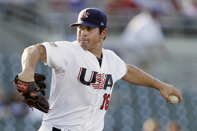 United States pitcher Carlos Rodon throws during the first inning of an exhibition game against Cuba, Thursday, July 18, 2013, in Des Moines, Iowa. (AP Photo/Charlie Neibergall)