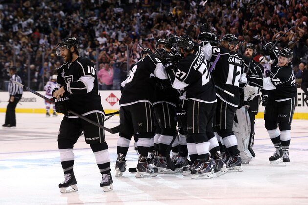 LOS ANGELES, CA - JUNE 04:  Justin Williams #14 of the Los Angeles Kings and teammates celebrate Williams overtime game-winner against the New York Rangers as the Kings defeated the Rangers 3-2 during Game One of the 2014 NHL Stanley Cup Final at the Staples Center on June 4, 2014 in Los Angeles, California.  (Photo by Bruce Bennett/Getty Images)