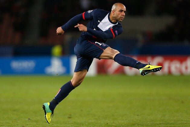 PARIS, FRANCE - NOVEMBER 05:  Alex of PSG hits a freekick during the UEFA Champions League Group C match between Paris Saint Germain and RSC Anderlecht at Parc des Princes on November 5, 2013 in Paris, France.  (Photo by Harry Engels/Getty Images)