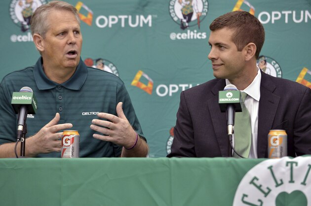 Boston Celtics general manager Danny Ainge, left, speaks alongside new head coach Brad Stevens, right, during a news conference where Stevens was introduced Friday, July 5, 2013, at the NBA basketball team's training facility in Waltham, Mass. Stevens twice led the Butler Bulldogs to the NCAA title game. He replaces Doc Rivers, who was traded to the Los Angeles Clippers. (AP Photo/Josh Reynolds)