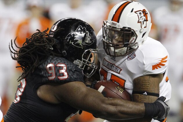 DETROIT, MI - DECEMBER 6: Running back William Houston #32 of the Bowling Green Falcons is tackled by defensive tackle Ken Bishop #93 of the Northern Illinois Huskies during the second half of the MAC Championship at Ford Field on December 6, 2013 in Detroit, Michigan. (Photo by Duane Burleson/Getty Images)
