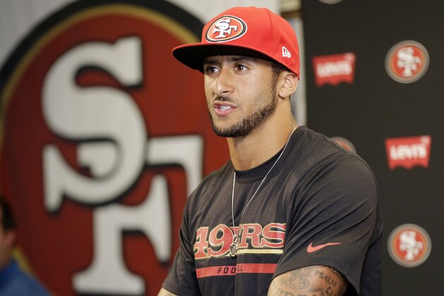 San Francisco 49ers quarterback Colin Kaepernick answers question during an NFL football press conference on Wednesday, June 4, 2014, in Santa Clara, Calif. Kaepernick received a new six-year contract extension Wednesday that keeps him with the franchise through the 2020 season. (AP Photo/Marcio Jose Sanchez)