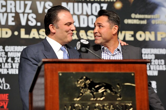 LAS VEGAS, NV - MAY 01:  CEO of Golden Boy Promotions Richard Schaefer (L) introduces President of Golden Boy Promotions Oscar De La Hoya at the final news conference for the bout between Floyd Mayweather Jr. and Robert Guerrero at the MGM Grand Hotel/Casino on May 1, 2013 in Las Vegas, Nevada. Mayweather will defend his WBC welterweight title against Guerrero.  (Photo by Jeff Bottari/Getty Images)