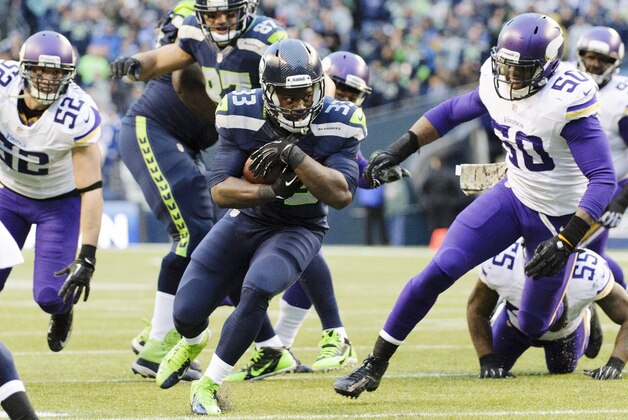 Nov 17, 2013; Seattle, WA, USA; Seattle Seahawks running back Christine Michael (33) carries the ball against the Minnesota Vikings during the second half at CenturyLink Field. Seattle defeated Minnesota 41-20. Mandatory Credit: Steven Bisig-USA TODAY Sports