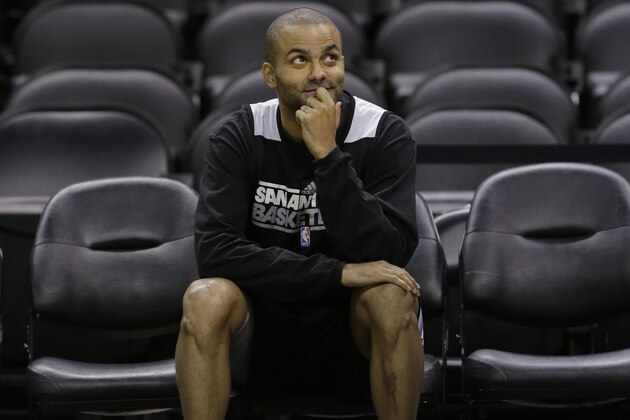 San Antonio Spurs' Tony Parker, of France, sits on the sidelines NBA basketball practice Wednesday, June 12, 2013, in San Antonio.  The Spurs lead the Miami Heat 2-1 in the best-of-seven series, Game 4 of the NBA finals series is scheduled for Thursday.  (AP Photo/Eric Gay)