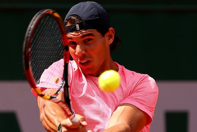 PARIS, FRANCE - JUNE 05:  Rafael Nadal of Spain returns a shot during a practice session on day twelve of the French Open at Roland Garros on June 5, 2014 in Paris, France.  (Photo by Dan Istitene/Getty Images)