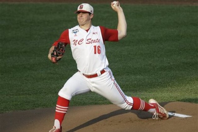 FILE - In this June 20, 2013 file photo, North Carolina State pitcher Carlos Rodon throws against North Carolina during an NCAA College World Series elimination baseball game in Omaha, Neb. The Houston Astros are on the clock to lead off the Major League Baseball draft for the third straight year Thursday night June 5, 2014. Houston has a few options with the first pick, including a pair of California high school stars in left-hander Brady Aiken and catcher-outfielder Alex Jackson, and North Carolina State lefty Carlos Rodon. (AP Photo/Nati Harnik, File)