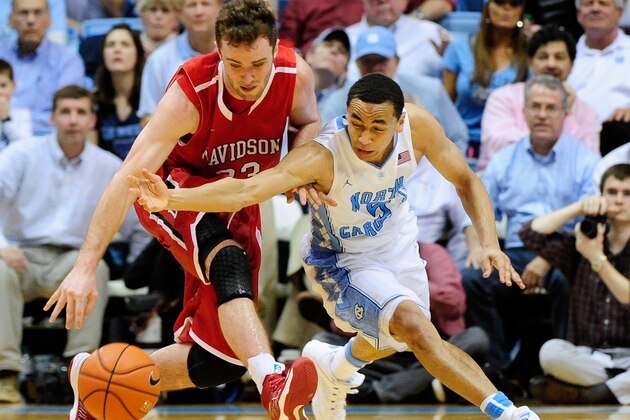 CHAPEL HILL, NC - DECEMBER 21: Tom Droney #23 of the Davidson Wildcats battles for a loose ball with Marcus Paige #5 of the North Carolina Tar Heels during a game at the Dean Smith Center on December 21, 2013 in Chapel Hill, North Carolina. North Carolina won 97-85 in overtime. (Photo by Grant Halverson/Getty Images) CHAPEL HILL, NC - DECEMBER 21: Tom Droney #23 of the Davidson Wildcats battles for a loose ball with Marcus Paige #5 of the North Carolina Tar Heels during a game at the Dean Smith Center on December 21, 2013 in Chapel Hill, North Carolina. North Carolina won 97-85 in overtime. (Photo by Grant Halverson/Getty Images)