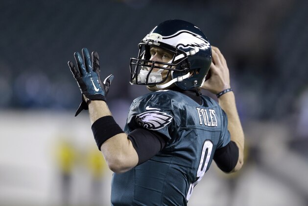 Philadelphia Eagles' Nick Foles warms up before an NFL wild-card playoff football game against the New Orleans Saints, Saturday, Jan. 4, 2014, in Philadelphia. (AP Photo/Julio Cortez)