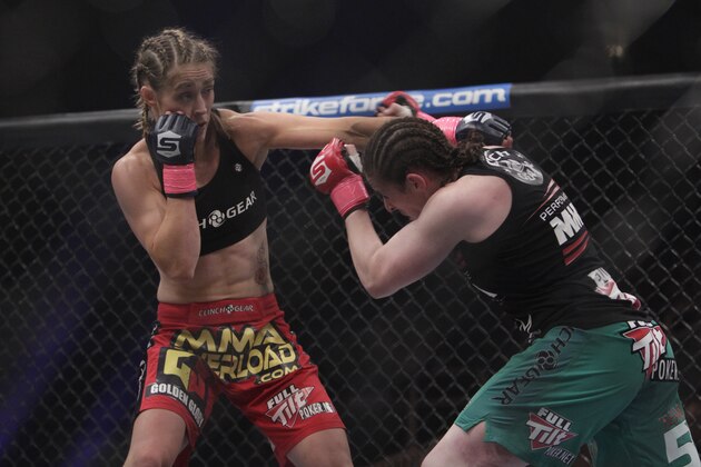 Marloes Coenen, left, from the Netherlands, fights Sarah Kaufman for the Strikeforce women's welterweight championship in San Jose, Calif., Saturday, Oct. 9, 2010. Coenen won by armbar submission in the third round. (AP Photo/Jeff Chiu)
