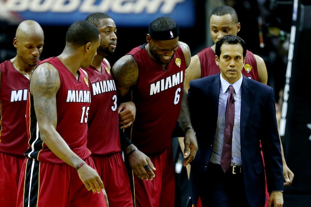 SAN ANTONIO, TX - JUNE 05:  LeBron James #6 of the Miami Heat is helped off the court after cramping up against the San Antonio Spurs during Game One of the 2014 NBA Finals at the AT&T Center on June 5, 2014 in San Antonio, Texas. NOTE TO USER: User expressly acknowledges and agrees that, by downloading and or using this photograph, User is consenting to the terms and conditions of the Getty Images License Agreement.  (Photo by Andy Lyons/Getty Images)