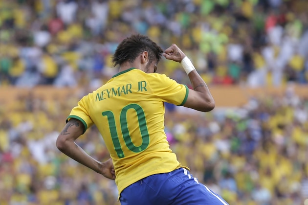 Brazil's Neymar celebrates after scoring against Panama during a friendly soccer match at the Serra Dourada stadium in Goiania, Brazil, Tuesday, June 3, 2014. (AP Photo/Andre Penner)