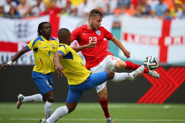 MIAMI GARDENS, FL - JUNE 04:  Luke Shaw of England and Jorge Guagua of Ecuador battle for the ball during the International friendly match between England and Ecuador at Sun Life Stadium on June 4, 2014 in Miami Gardens, Florida.  (Photo by Richard Heathcote/Getty Images)