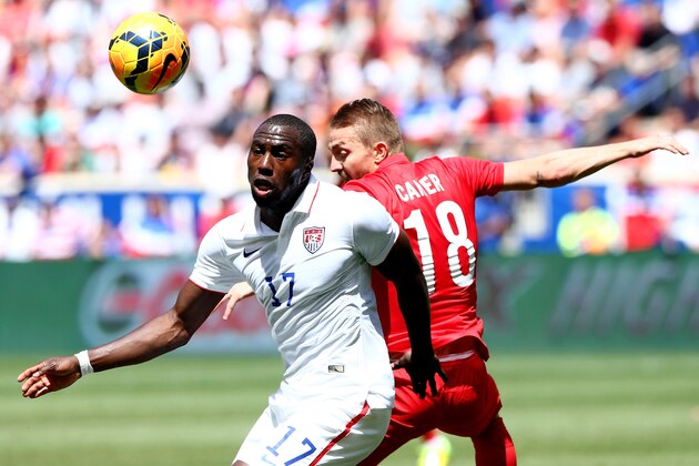 HARRISON, NJ - JUNE 01:  Jozy Altidore #17 of United States and Caner Erkin #18 of Turkey fight for the ball in the first half during an international friendly match at Red Bull Arena on June 1, 2014 in Harrison, New Jersey.  (Photo by Elsa/Getty Images)