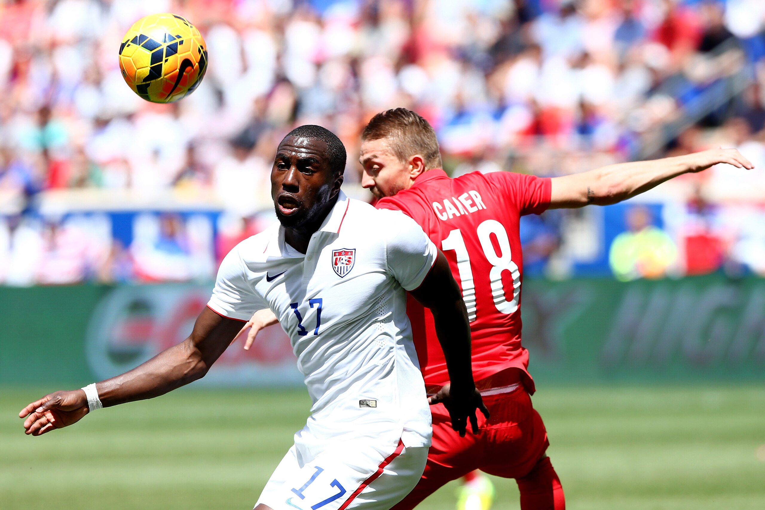 HARRISON, NJ - JUNE 01:  Jozy Altidore #17 of United States and Caner Erkin #18 of Turkey fight for the ball in the first half during an international friendly match at Red Bull Arena on June 1, 2014 in Harrison, New Jersey.  (Photo by Elsa/Getty Images)