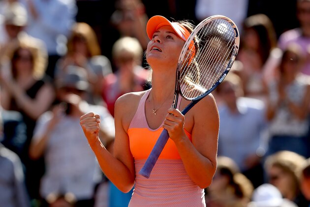 PARIS, FRANCE - JUNE 05:  Maria Sharapova of Russia celebrates victory during her women's singles semi-final match against Eugenie Bouchard of Canada on day twelve of the French Open at Roland Garros on June 5, 2014 in Paris, France.  (Photo by Matthew Stockman/Getty Images)
