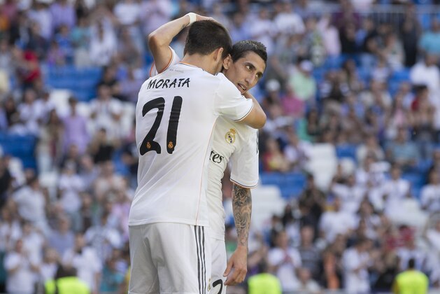 Real Madrid's Angel Di Maria from Argentina, right, celebrates his goal with teammate Alvaro Morata during a Spanish La Liga soccer match between Real Madrid and Espanyol at the Santiago Bernabeu stadium  in Madrid, Spain, Saturday, May 17, 2014. (AP Photo/Daniel Ochoa de Olza)
