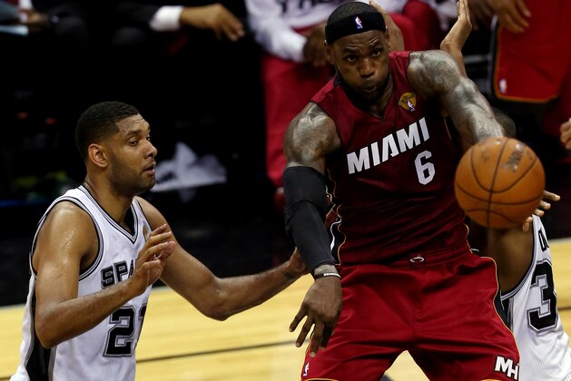 SAN ANTONIO, TX - JUNE 05:  LeBron James #6 of the Miami Heat makes a pass against the San Antonio Spurs during Game One of the 2014 NBA Finals at the AT&T Center on June 5, 2014 in San Antonio, Texas. NOTE TO USER: User expressly acknowledges and agrees that, by downloading and or using this photograph, User is consenting to the terms and conditions of the Getty Images License Agreement.  (Photo by Chris Covatta/Getty Images)