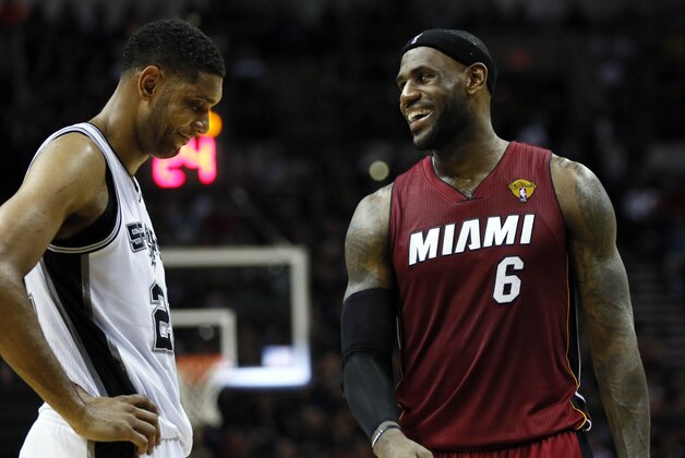 Jun 5, 2014; San Antonio, TX, USA; Miami Heat forward LeBron James (6) talks to San Antonio Spurs forward Tim Duncan (21) during the second quarter in game one of the 2014 NBA Finals at AT&T Center. Mandatory Credit: Soobum Im-USA TODAY Sports