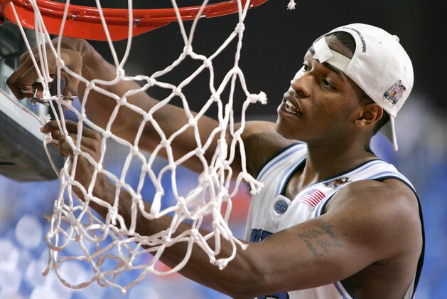 North Carolina's Rashad McCants cuts down part of the net during UNC's celebration following their 75-70 win over Illinois in the NCAA championship game Monday, April 4, 2005, in St. Louis. (AP Photo/Eric Gay)
