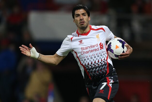 Liverpool's Luis Suarez celebrates after scoring his side's third goal a goal during the English Premier League soccer match between Crystal Palace and Liverpool at Selhurst Park stadium in London, Monday, May 5, 2014. (AP Photo/Alastair Grant)