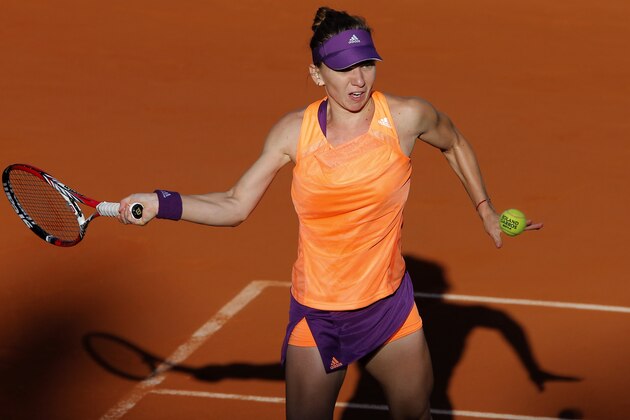 Romania's Simona Halep returns the ball during the semifinal match of the French Open tennis tournament against Germany's Andrea Petkovic at the Roland Garros stadium, in Paris, France, Thursday, June 5, 2014. Halep won in two sets 6-2, 7-6. (AP Photo/Michel Spingler) Romania's Simona Halep returns the ball during the semifinal match of the French Open tennis tournament against Germany's Andrea Petkovic at the Roland Garros stadium, in Paris, France, Thursday, June 5, 2014. Halep won in two sets 6-2, 7-6. (AP Photo/Michel Spingler)