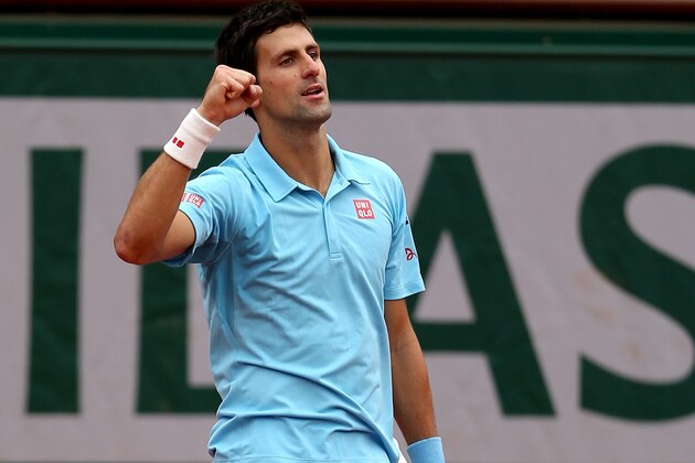 PARIS, FRANCE - JUNE 01:  Novak Djokovic of Serbia celebrates victory in his men's singles match against Jo-Wilfried Tsonga of France on day eight of the French Open at Roland Garros on June 1, 2014 in Paris, France.  (Photo by Matthew Stockman/Getty Images)