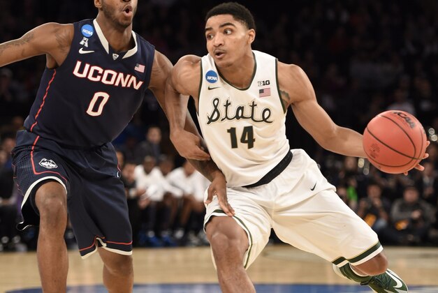 Mar 30, 2014; New York, NY, USA; Michigan State Spartans guard Gary Harris (14) drives to the basket against Connecticut Huskies de Phillip Nolan (0) during the second half in the finals of the east regional of the 2014 NCAA Mens Basketball Championship tournament at Madison Square Garden. Mandatory Credit: Robert Deutsch-USA TODAY Sports
