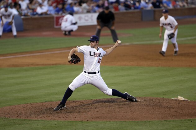 United States pitcher Carlos Rodon throws against Cuba during an exhibition baseball game in Durham, N.C., Tuesday, July 23, 2013. (AP Photo/Gerry Broome)