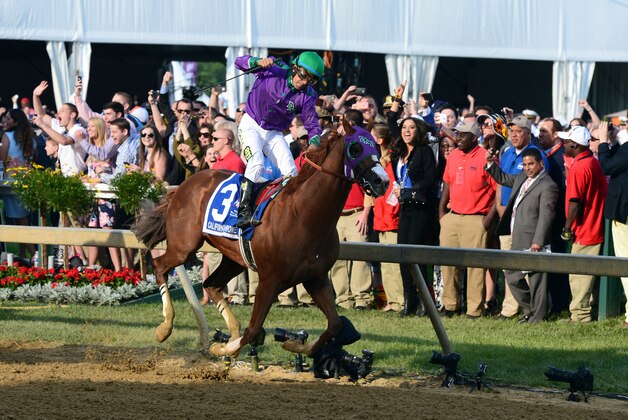 May 17, 2014; Baltimore, MD, USA; Victor Espinoza aboard California Chrome celebrates winning the 139th Preakness Stakes at Pimlico Race Course. Mandatory Credit: Tommy Gilligan-USA TODAY Sports
