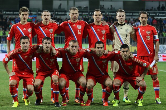 FILE - In this Oct. 15, 2013 file photo, Russia national team poses prior to the start the World Cup Group F qualifying soccer match between Russia and Azerbaijan in Baku, Azerbaijan. Foreground from left: Victor Faizulin, Dmitry Kombarov, Denis Glushakov, Alexander Kerzhakov and Alexander Samedov. Background from left: Alexander Kokorin, Alexey Kozlov, Vasili Berezutsky, Sergey Ignashevich, Igor Akinfeev, and Roman Shirokov. The draw for the 2014 World Cup finals takes place Friday Dec. 6, 2013 near Salvador, Brazil. The 32 teams will be drawn into eight groups of four. The top two in each group will progress to the knockout stages. Twelve stadiums in twelve cities will host matches. (AP Photo/Alexander Mysyakin, File)