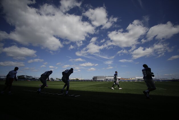 New York Giants players finish drills during NFL football training camp Wednesday, Aug. 14, 2013, in East Rutherford, N.J.  (AP Photo/Frank Franklin II)
