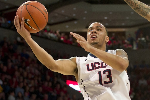 DALLAS, TX - JANUARY 4: Shabazz Napier #13 of the Connecticut Huskies drives to the basket against the SMU Mustangs on January 4, 2014 at Moody Coliseum in Dallas, Texas.  (Photo by Cooper Neill/Getty Images)
