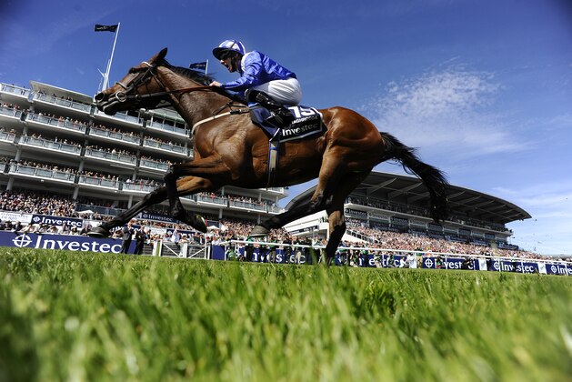 EPSOM, ENGLAND - JUNE 06:  Paul Hanagan riding Taghrooda win The Investec Oaks at Epsom racecourse on June 06, 2014 in Epsom, England. (Photo by Alan Crowhurst/Getty Images)