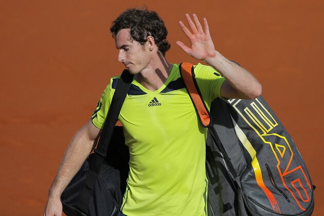 Britain's Andy Murray leaves the court after losing to Spain's Rafael Nadal in their semifinal match of  the French Open tennis tournament at the Roland Garros stadium, in Paris, France, Friday, June 6, 2014. Nadal won 6-3, 6-2, 6-1. (AP Photo/Michel Spingler)