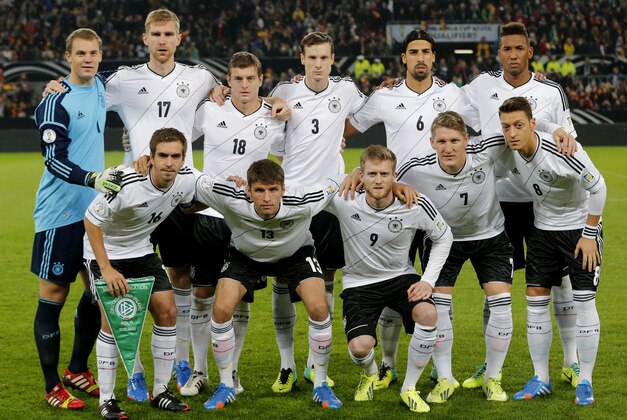 FILE - In this Oct 11, 2013 file photo, Germany soccer team poses prior to the start the World Cup Group C qualifying soccer match between Germany and Ireland in Cologne, Germany. Background from left: Manuel Neuer, Per Mertesacker, Toni Kroos. Marcell Jansen, Sami Khedira and Jerome Boateng. Foreground from left: Philipp Lahm, Thomas Mueller, Andre Schuerrle, Bastian Schweinsteiger and Mesut Ozil.  (AP Photo/Michael Probst, File)